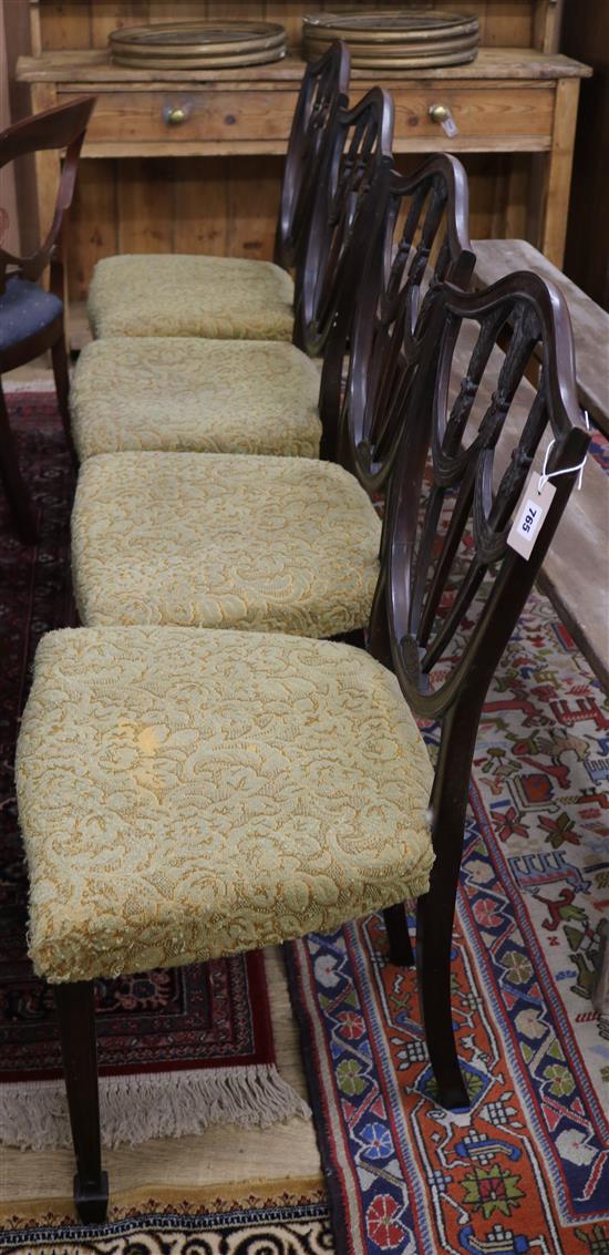 A set of four Hepplewhite style mahogany dining chairs